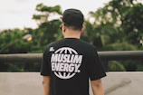 a man wearing a t - shirt that says muslim energy