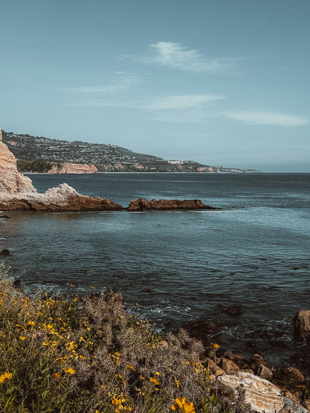 a large body of water surrounded by rocks