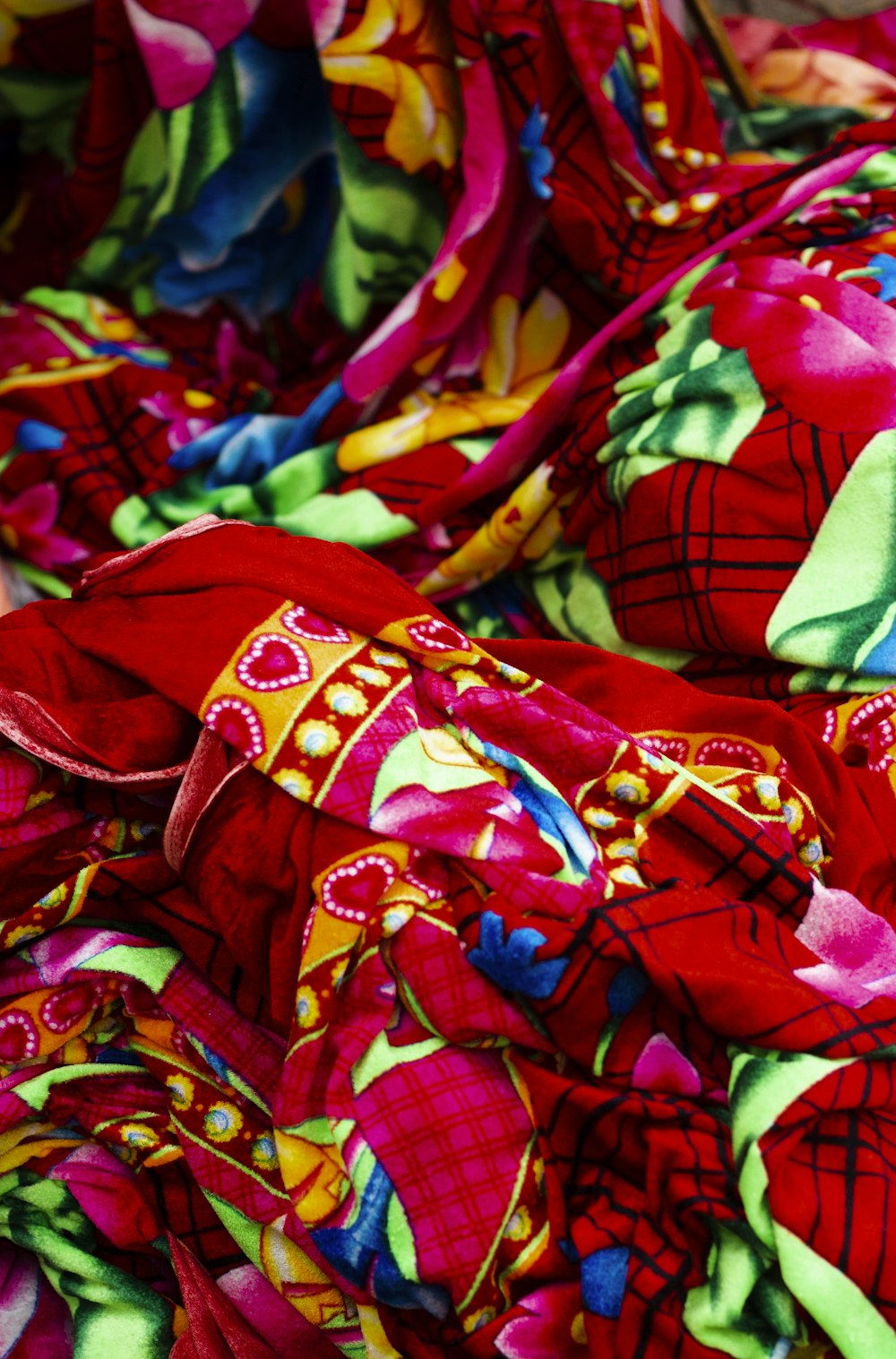 a close up of a red and green cloth