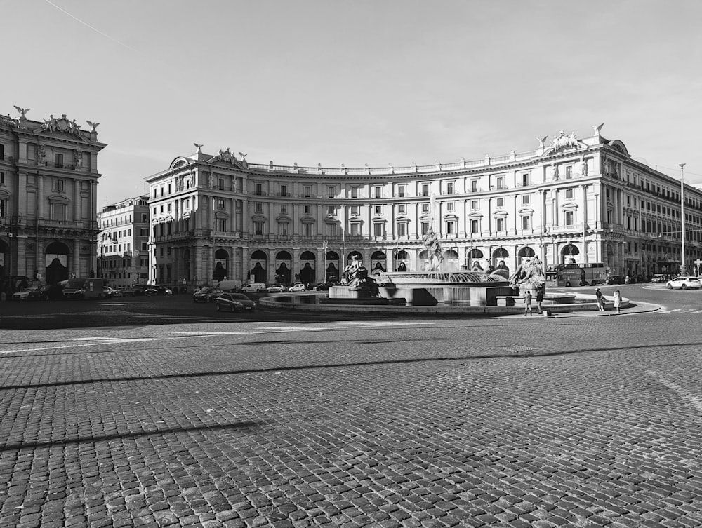 a black and white photo of a city square