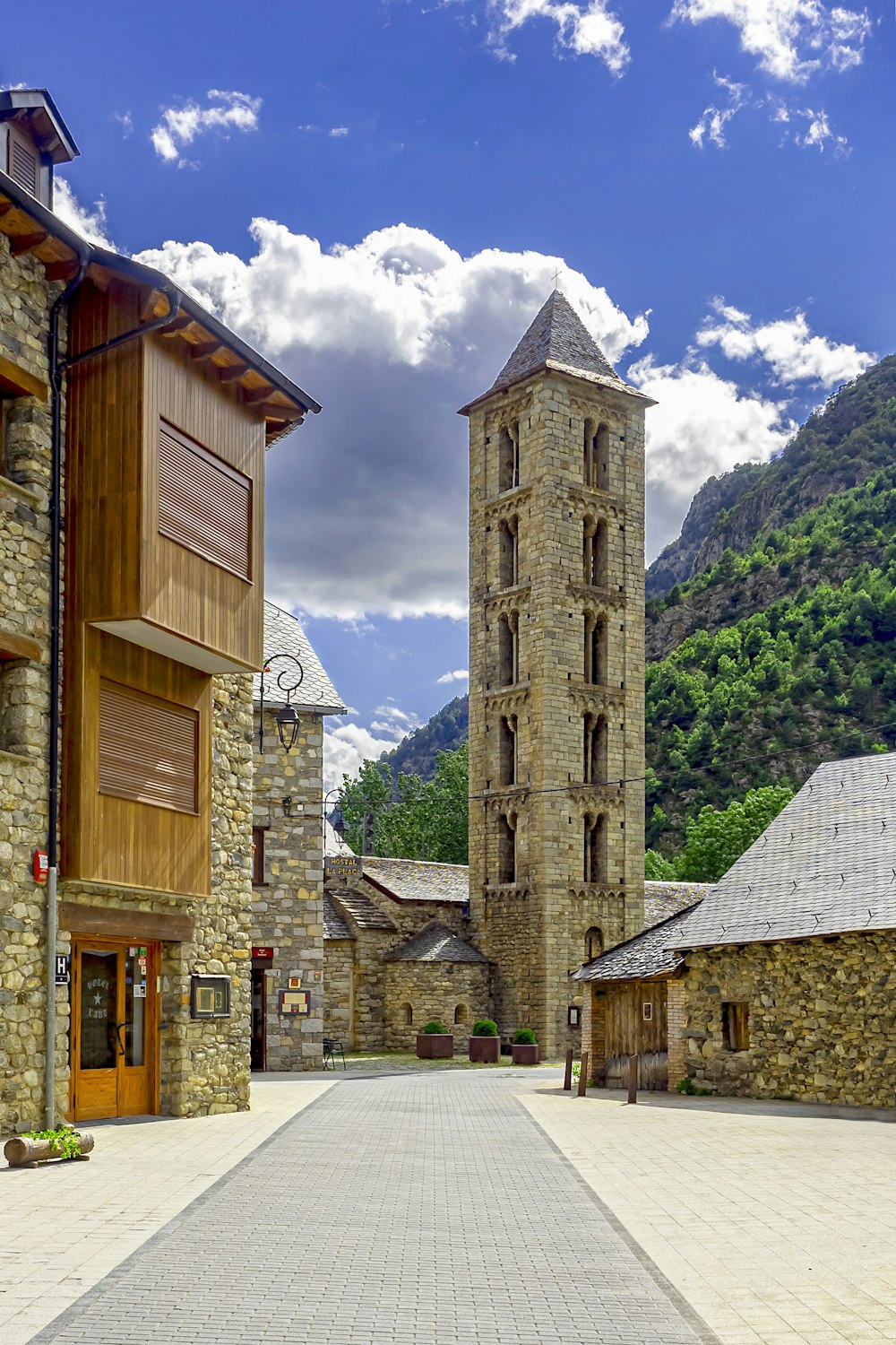 a stone building with a clock tower in the middle of it