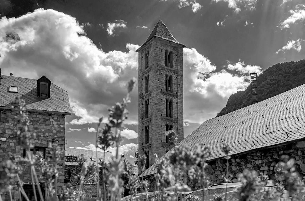 a black and white photo of a church tower