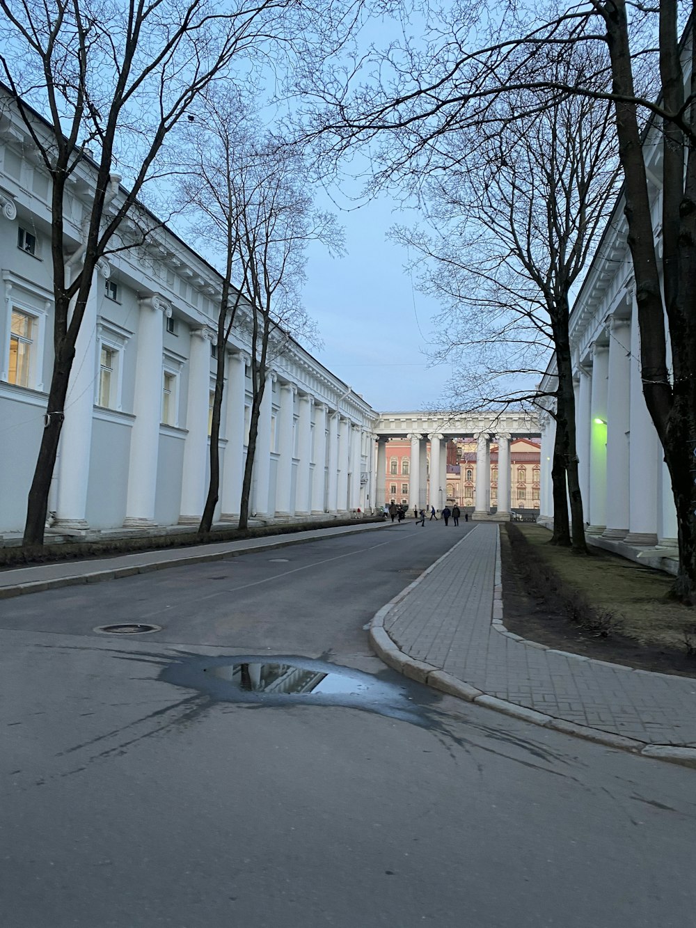 a street with a puddle of water in the middle of it