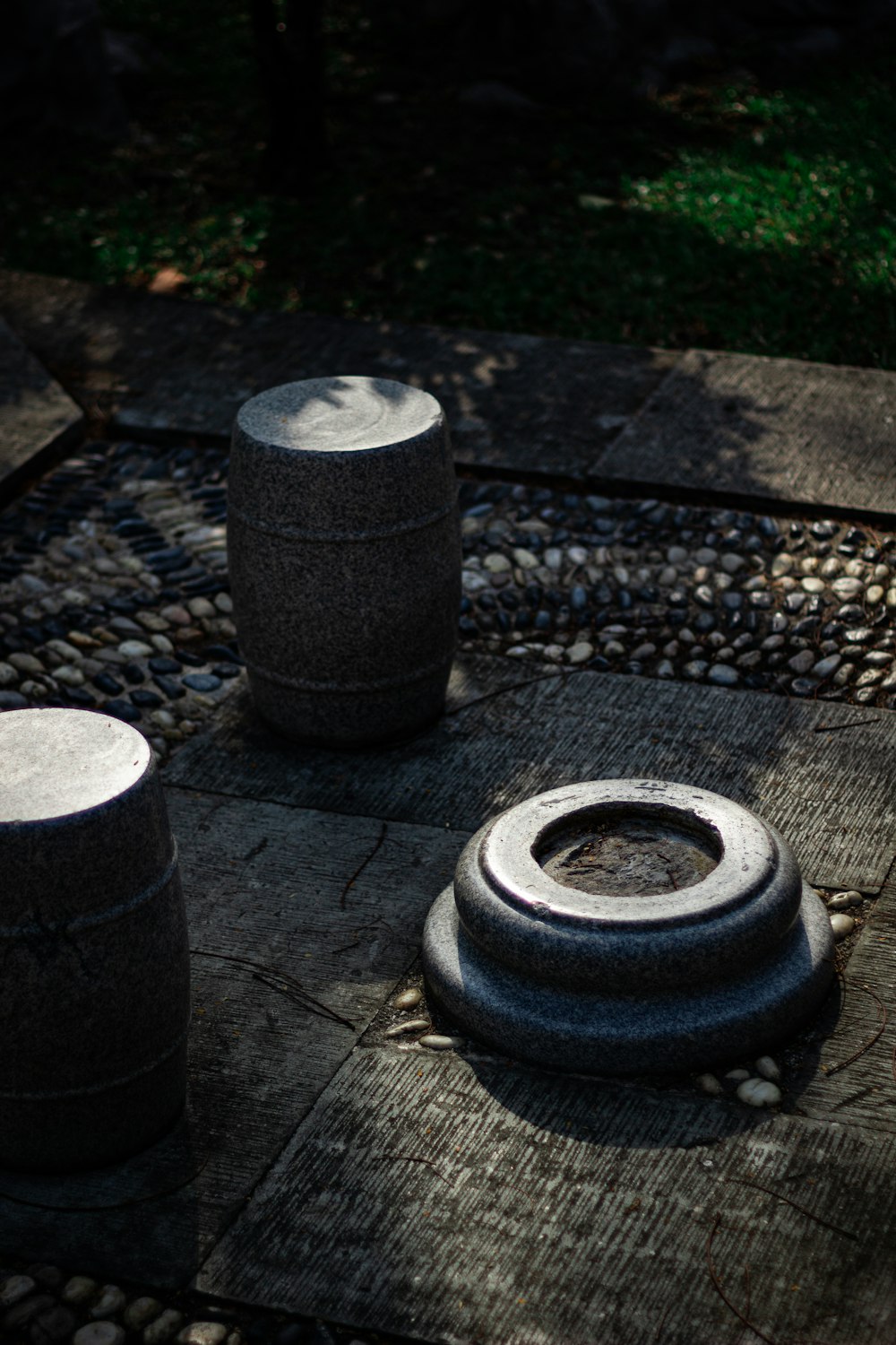 a couple of barrels sitting on top of a stone floor