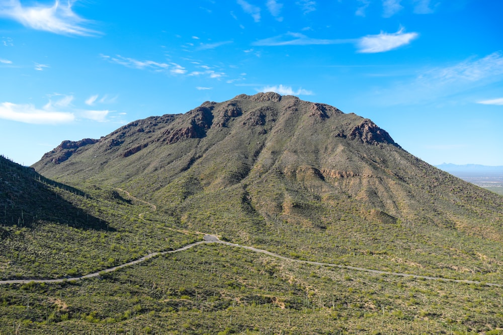 a view of a mountain with a road going through it