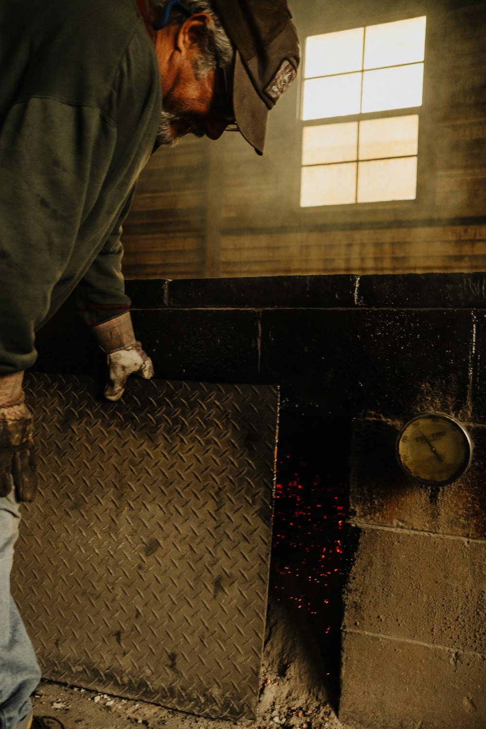 a man working on a piece of metal