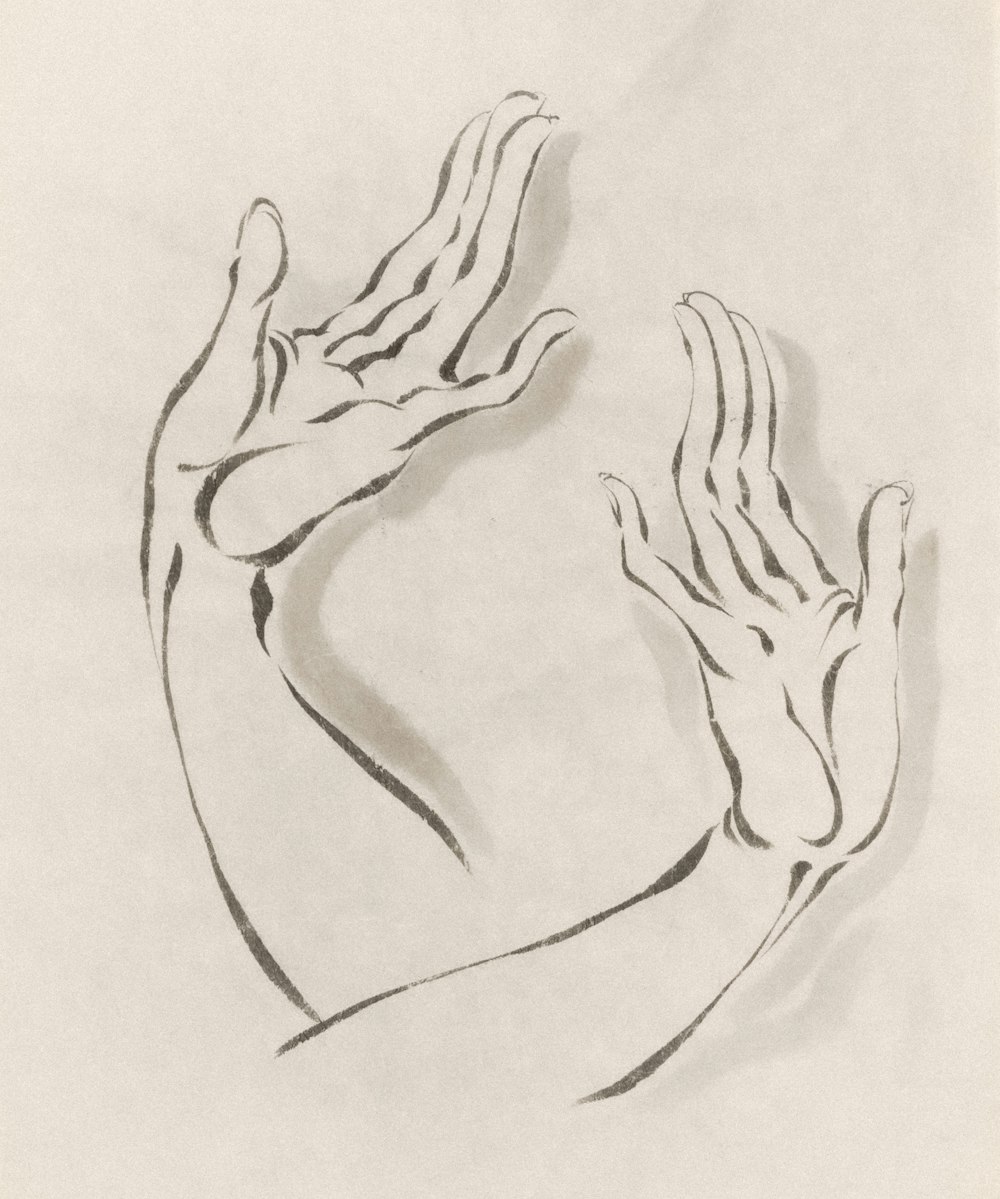 a black and white drawing of a hand holding something