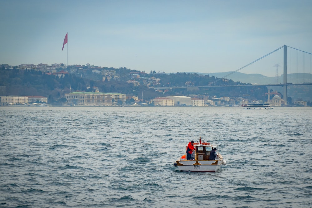 a small boat in a large body of water