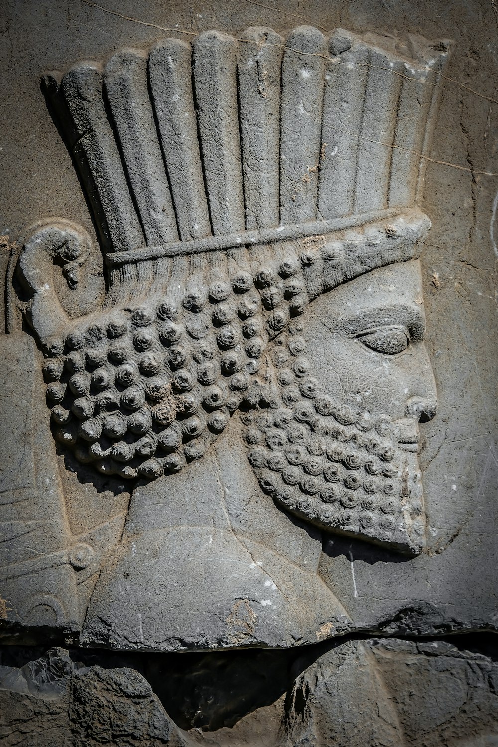 a close up of a stone sculpture of a man's head