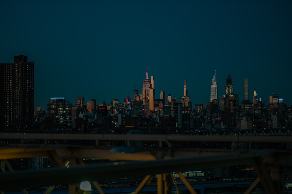 a view of a city at night from a bridge