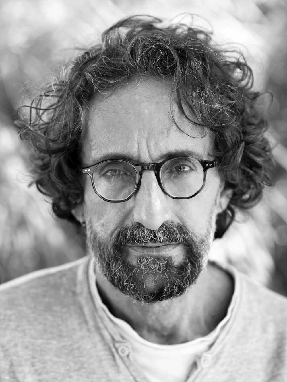 Professional man in his late forties, thoughtful portrait