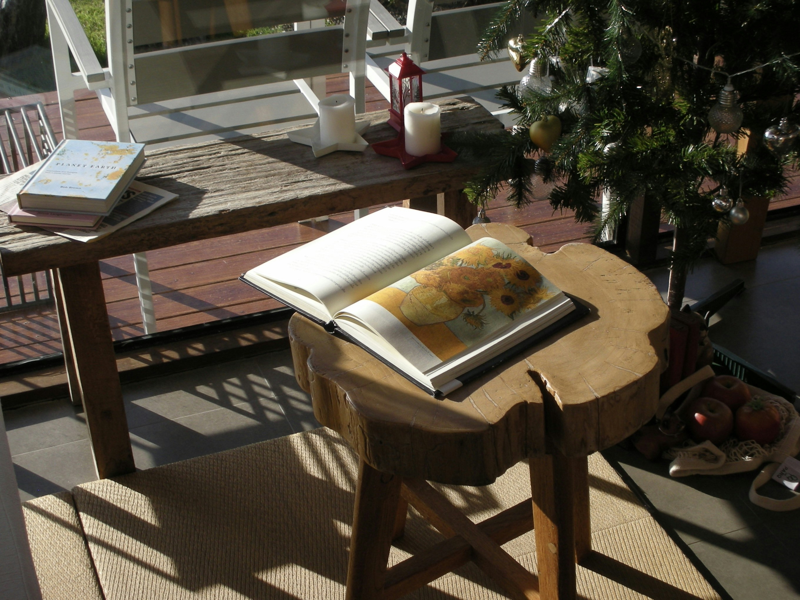 an open book sitting on top of a wooden table