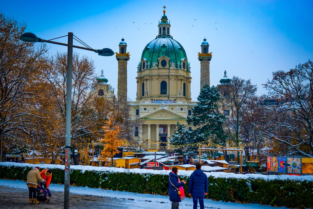 a couple of people that are standing in the snow