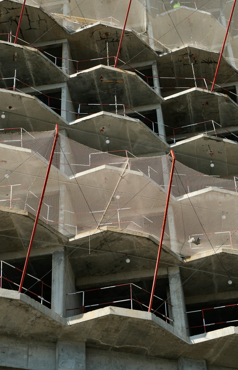 a bunch of umbrellas that are on the side of a building