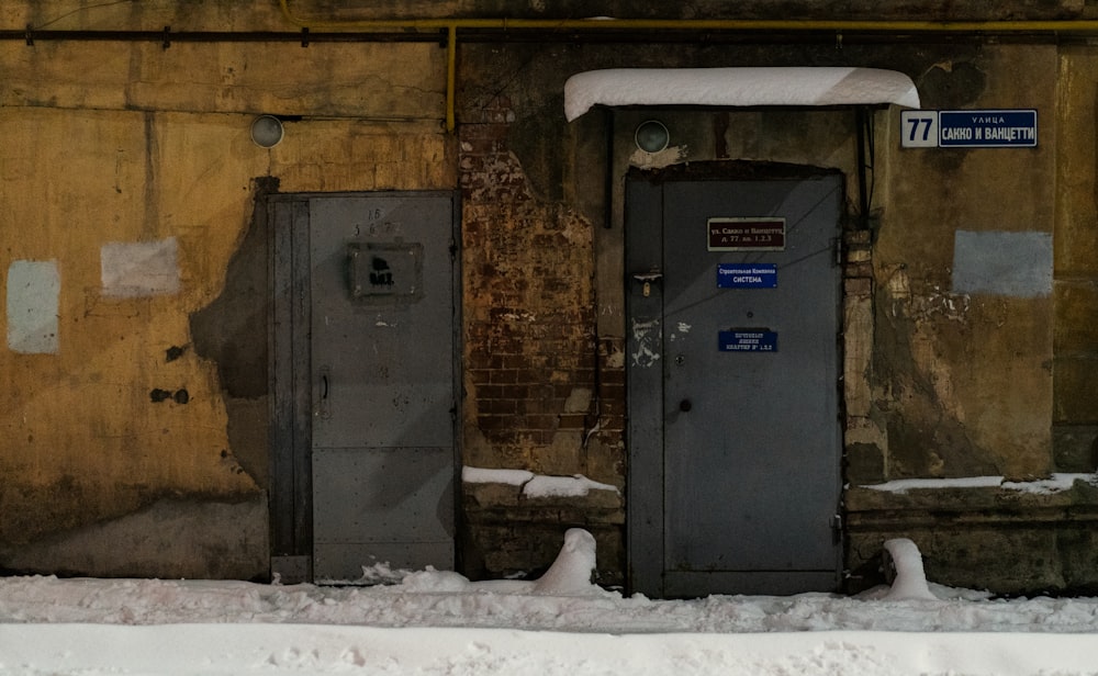 a couple of doors that are in the snow