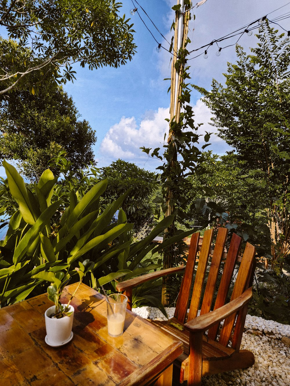 a wooden chair sitting on top of a wooden table