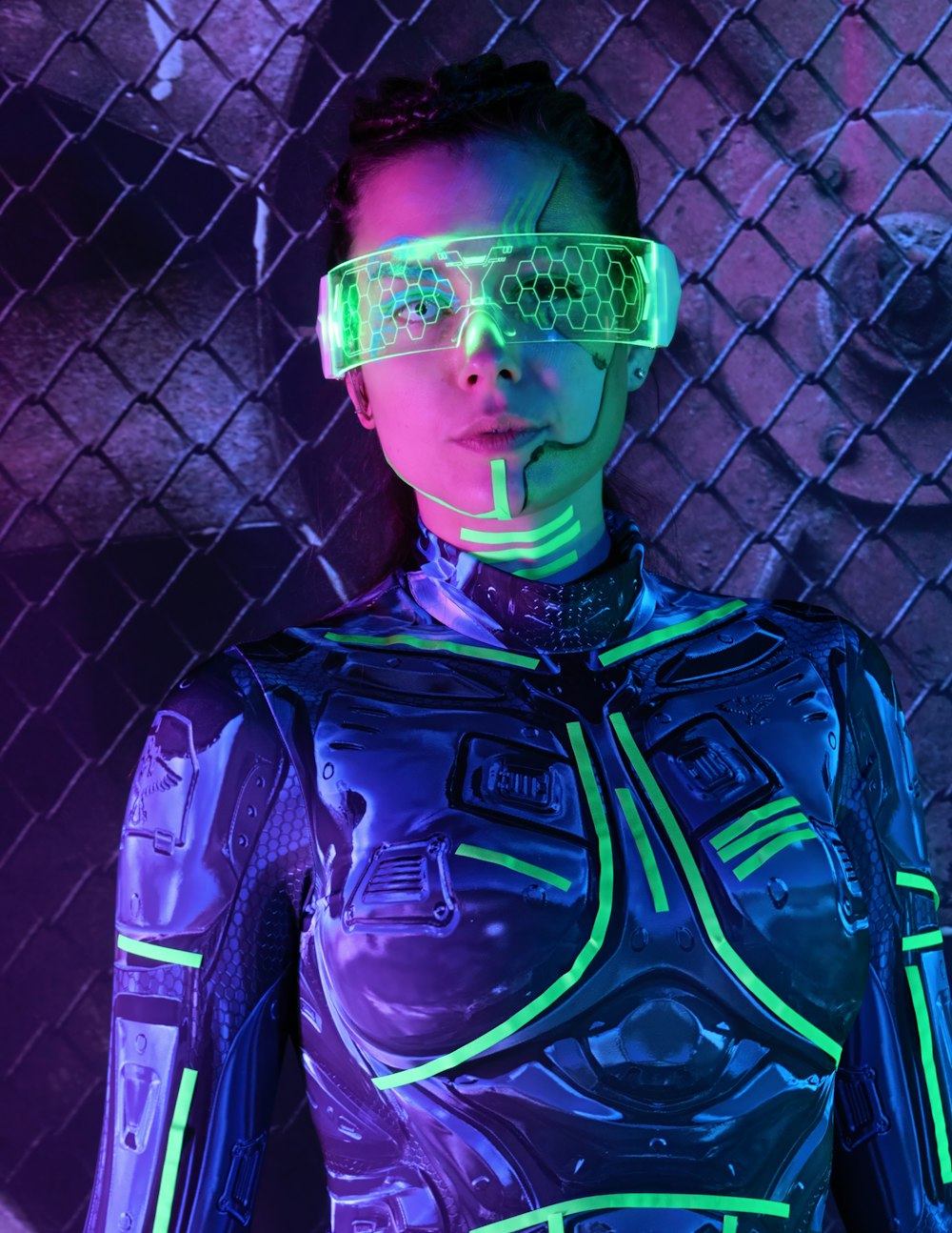 a woman in a futuristic suit with neon glasses