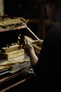 a man is working on a piece of wood