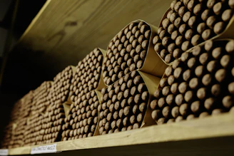 a stack of chocolate bars sitting on top of a wooden shelf
