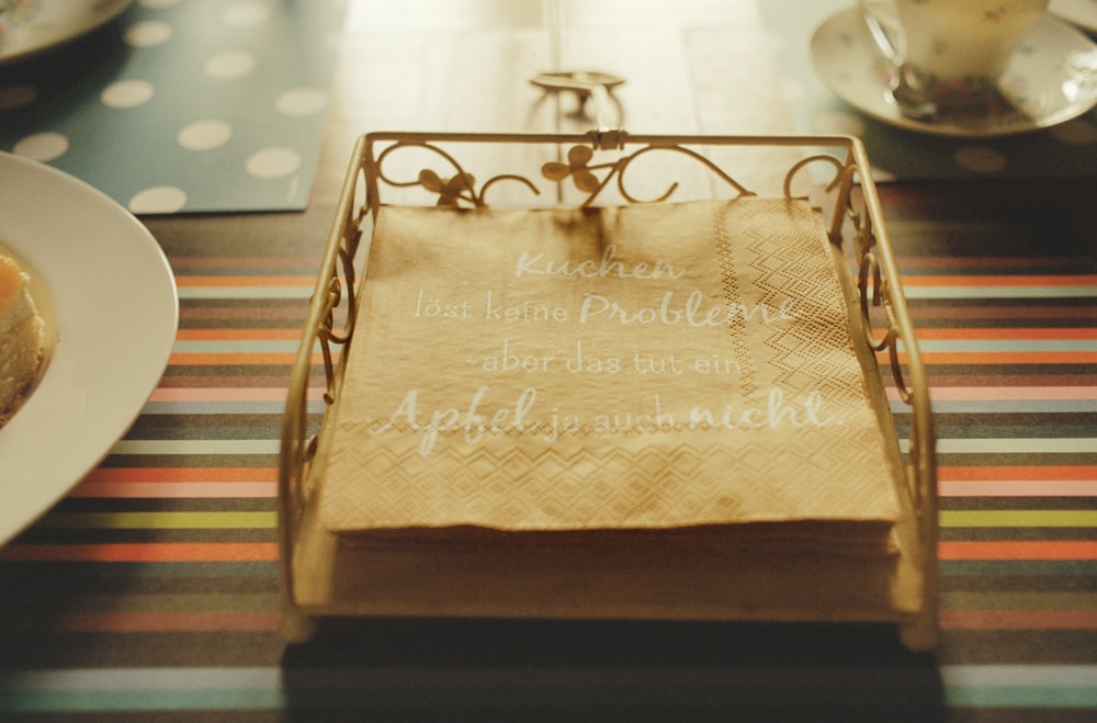 a table topped with a plate of food and a napkin