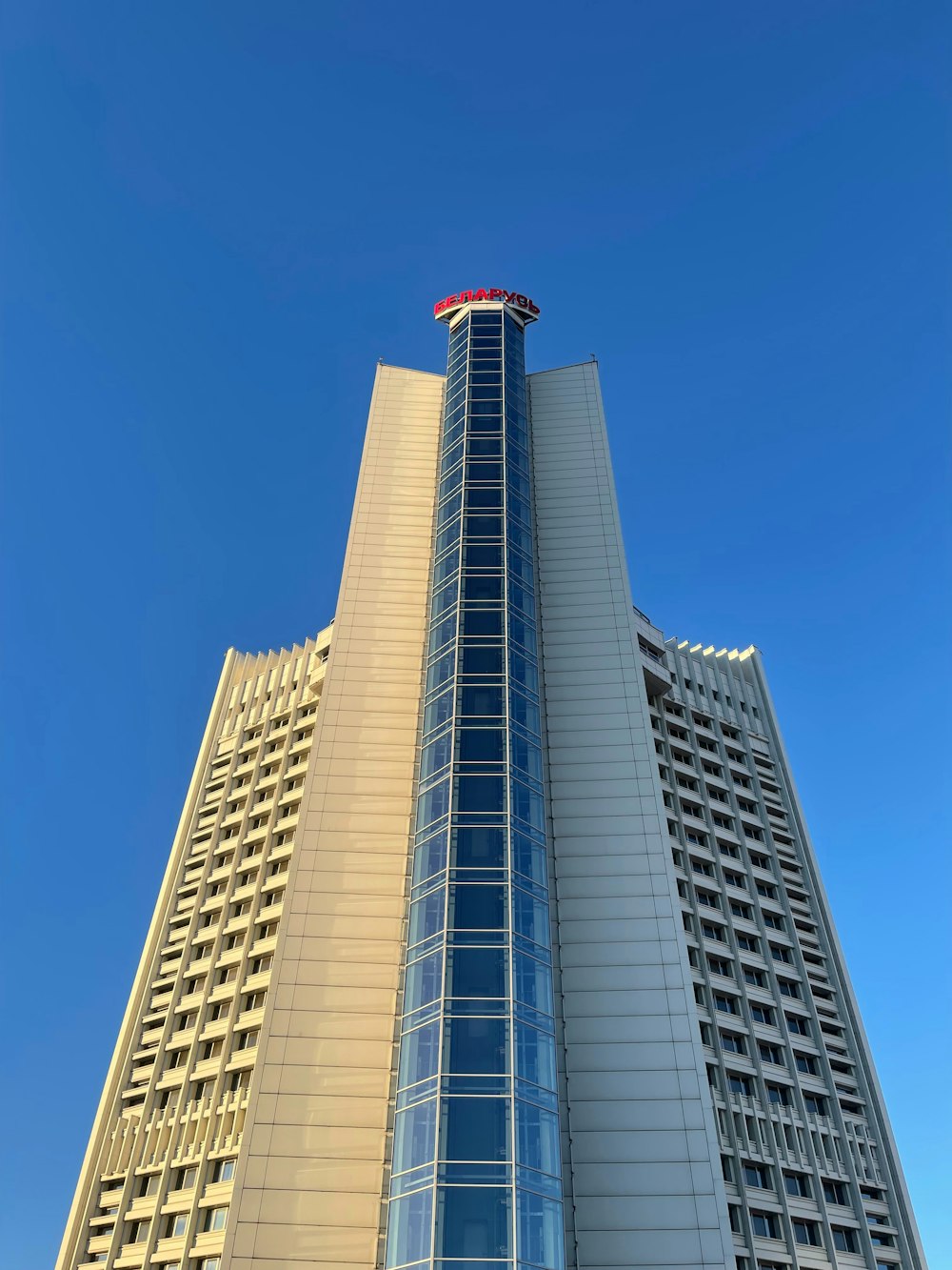 a very tall building with a sky background