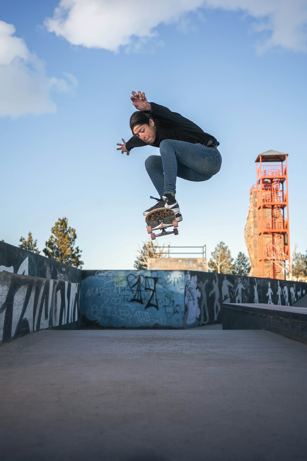 a man flying through the air while riding a skateboard