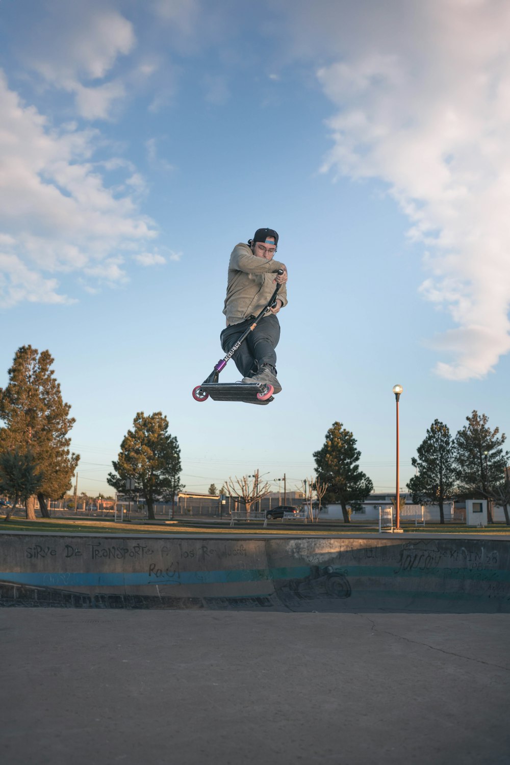 a man flying through the air while riding a skateboard