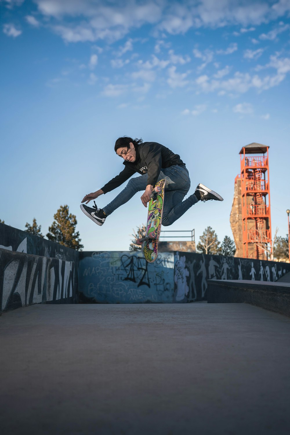 a man flying through the air while riding a skateboard