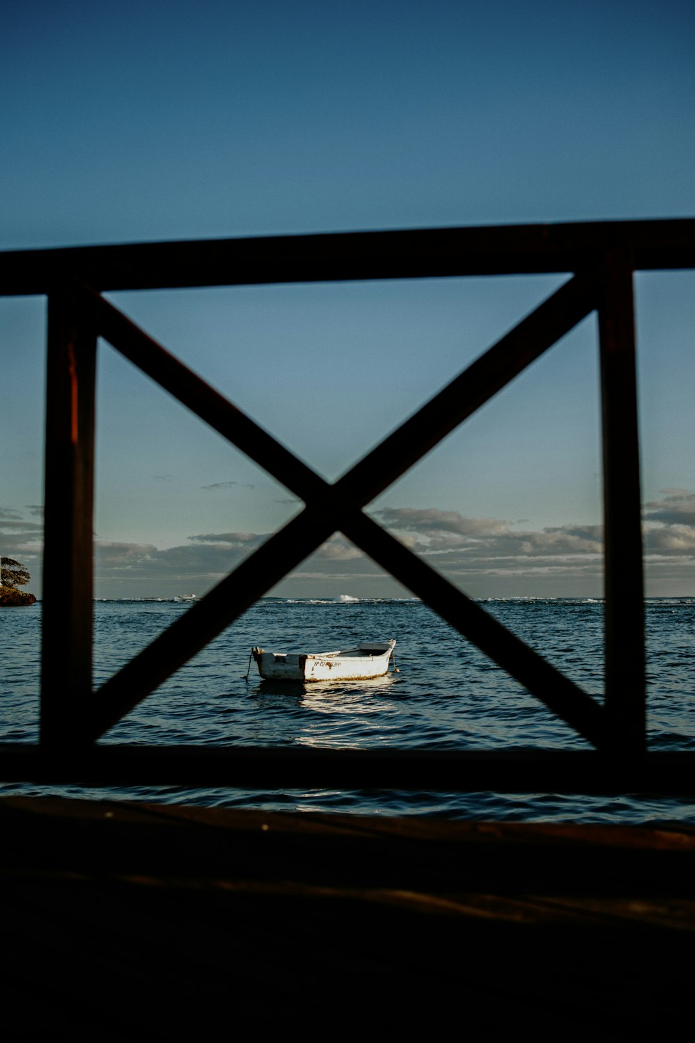 a small boat floating on top of a body of water