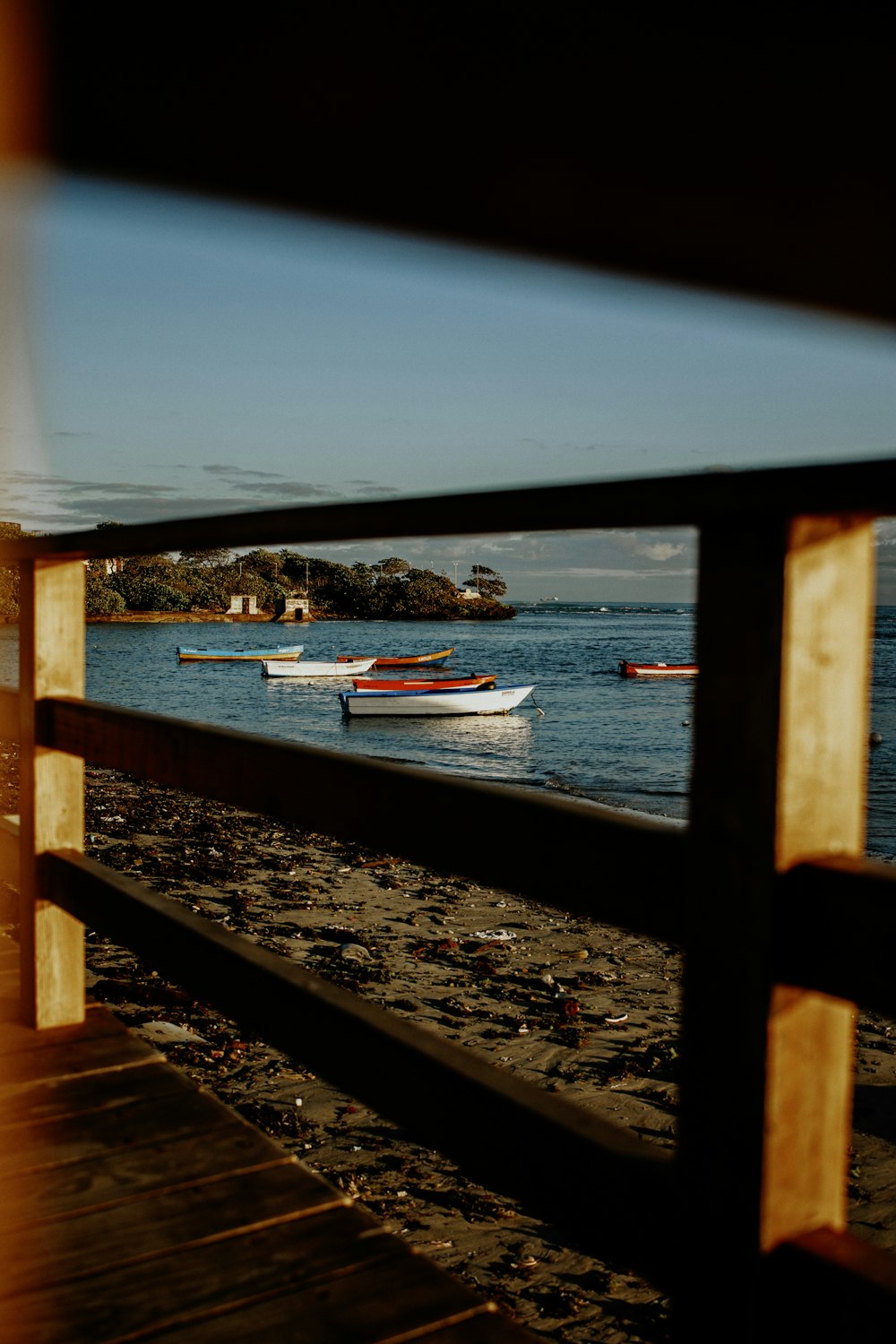 a view of a beach with boats in the water