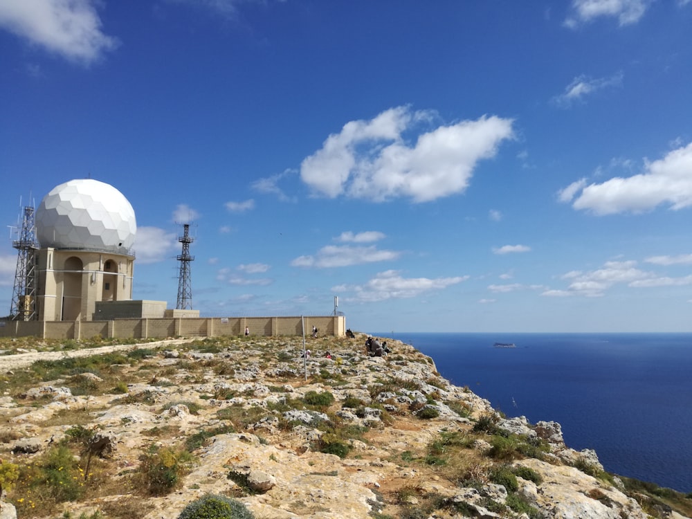 a large white dome sitting on top of a hill