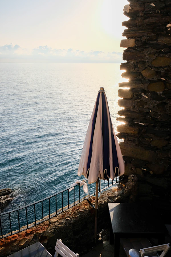 Terrace table with umbrella overlooking the sea