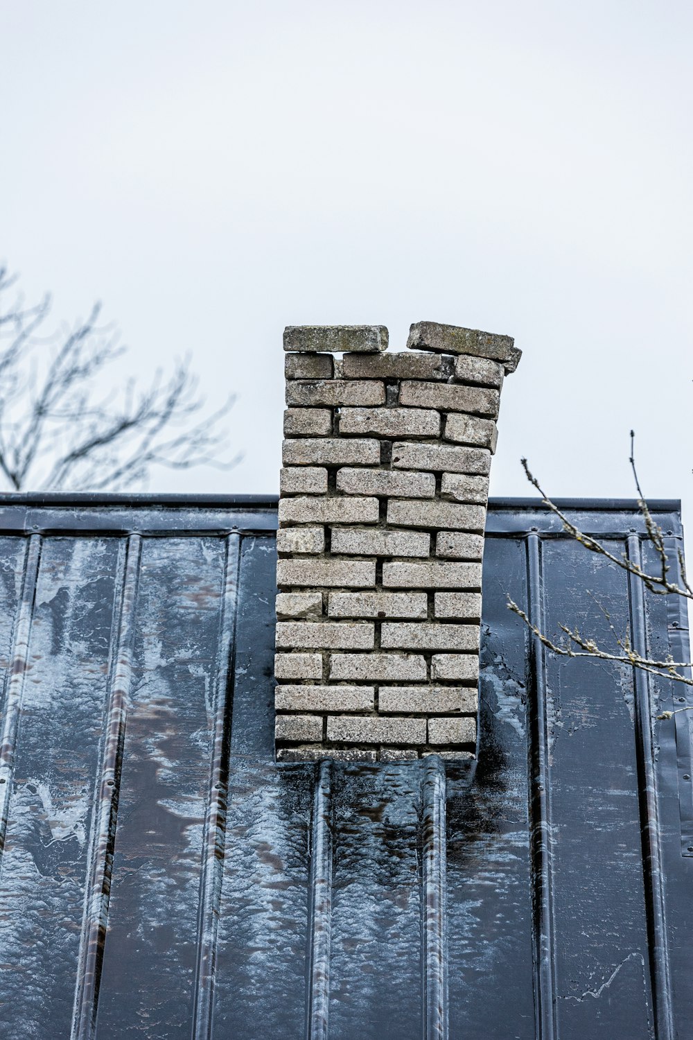 a brick wall with a window on top of it