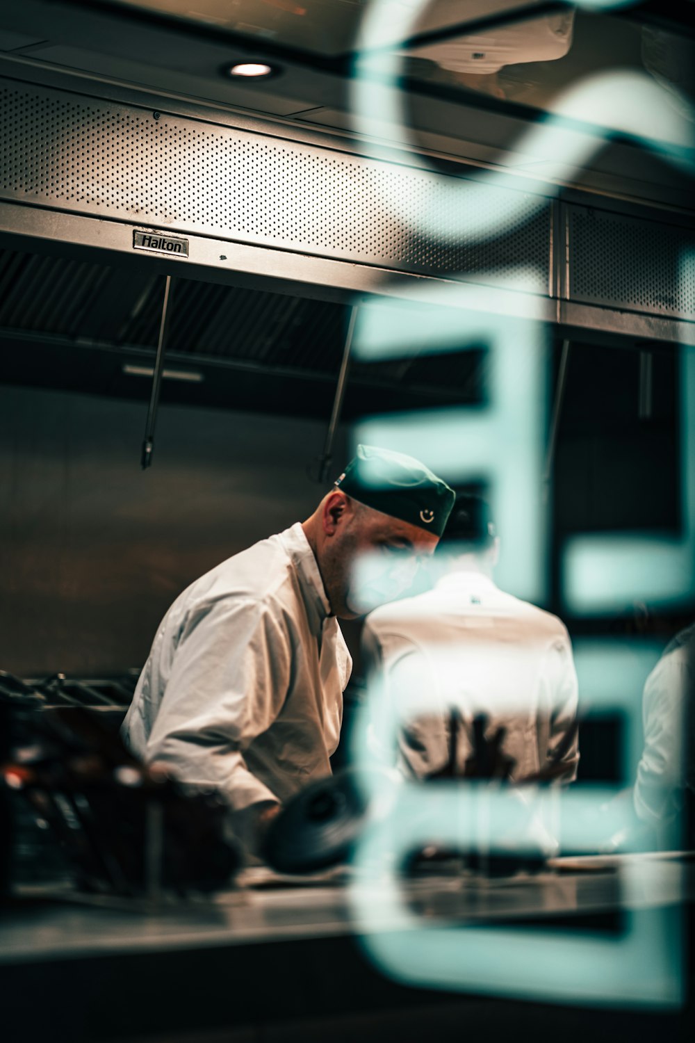 a man standing in a kitchen preparing food