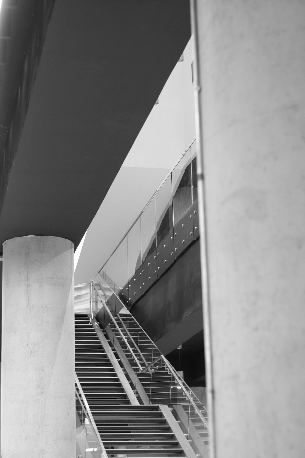 a black and white photo of a stair case