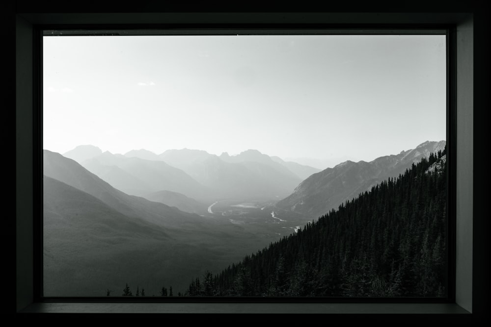 a black and white photo of a mountain range