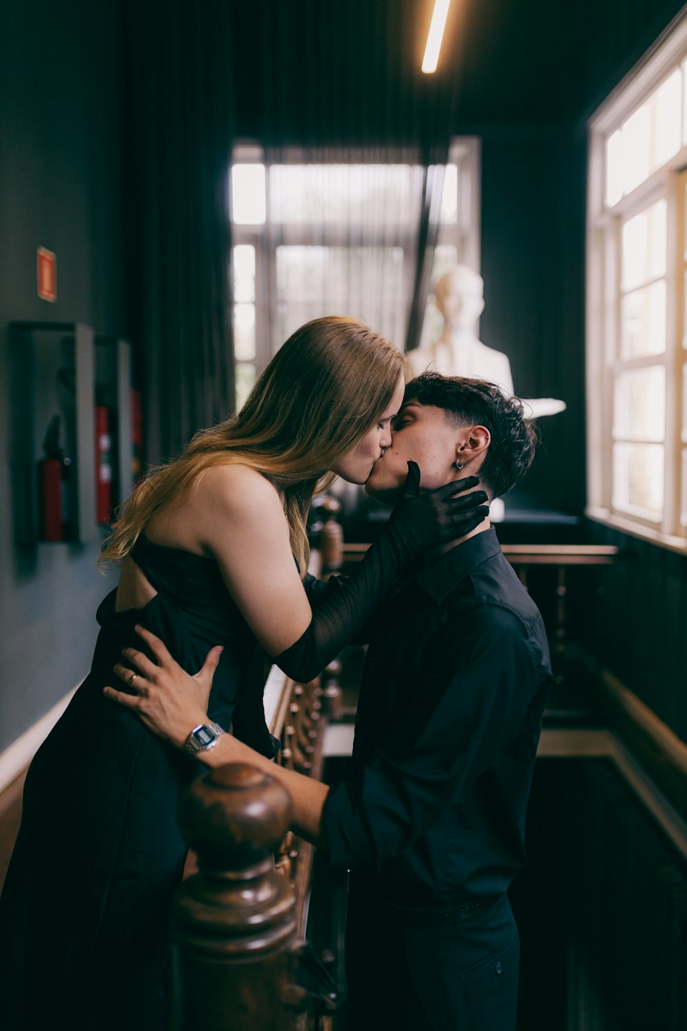 a man kissing a woman on the cheek