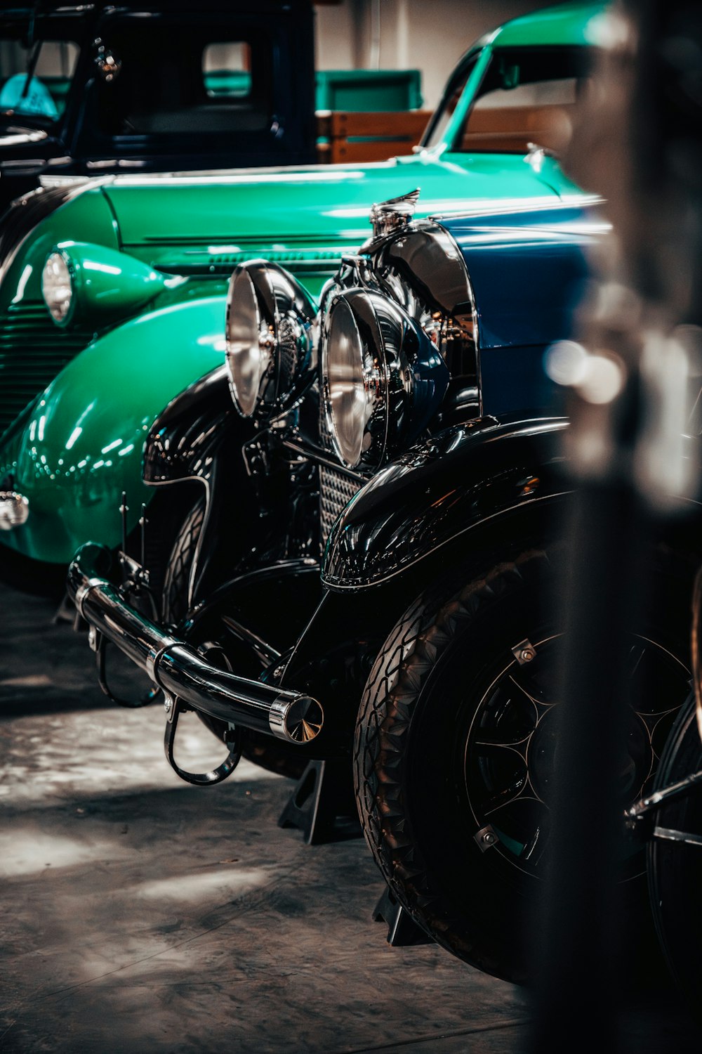 a row of classic cars parked next to each other