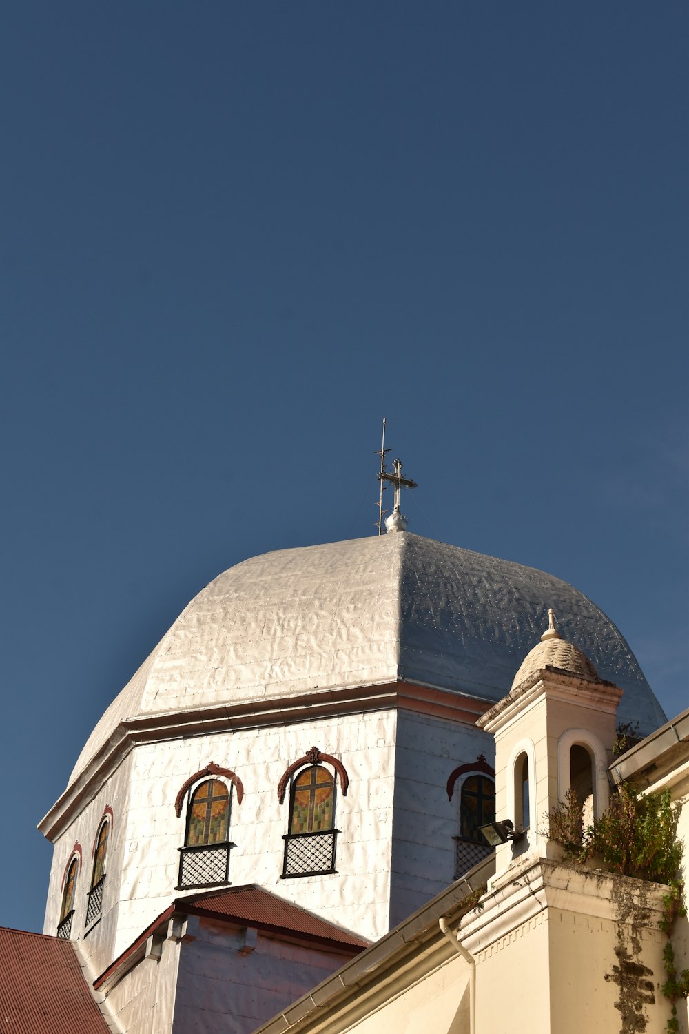 a church steeple with a cross on top