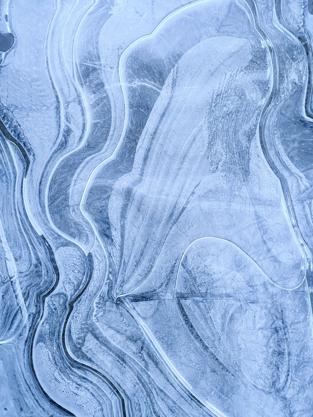 an aerial view of a snow covered landscape