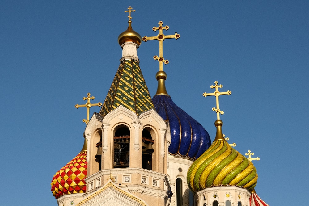 a church steeple with crosses on top of it