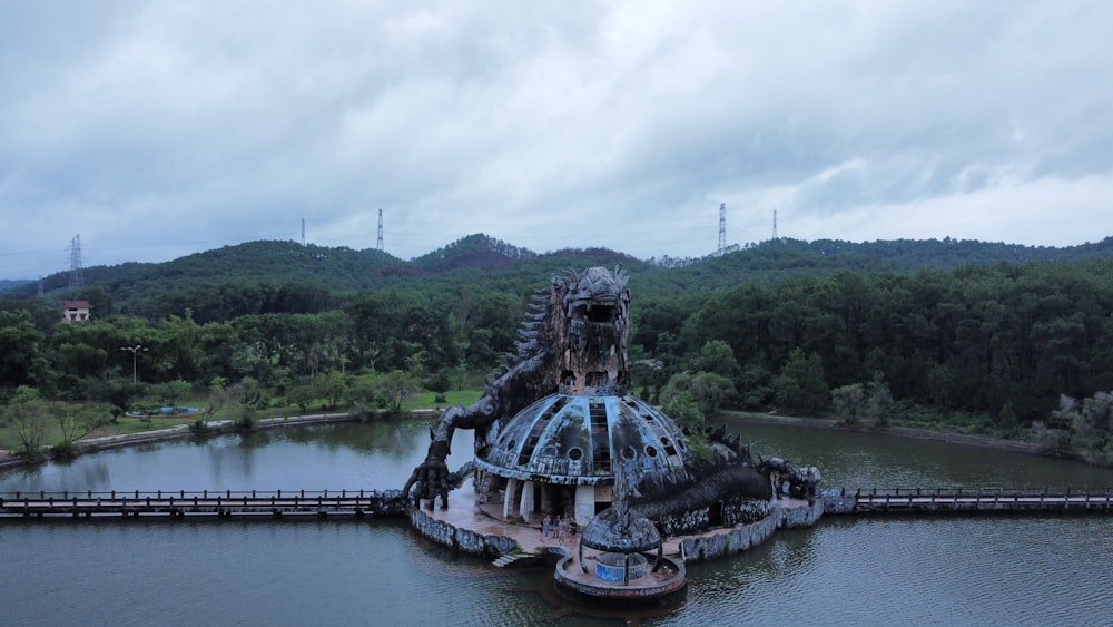 an aerial view of a large structure in the middle of a lake