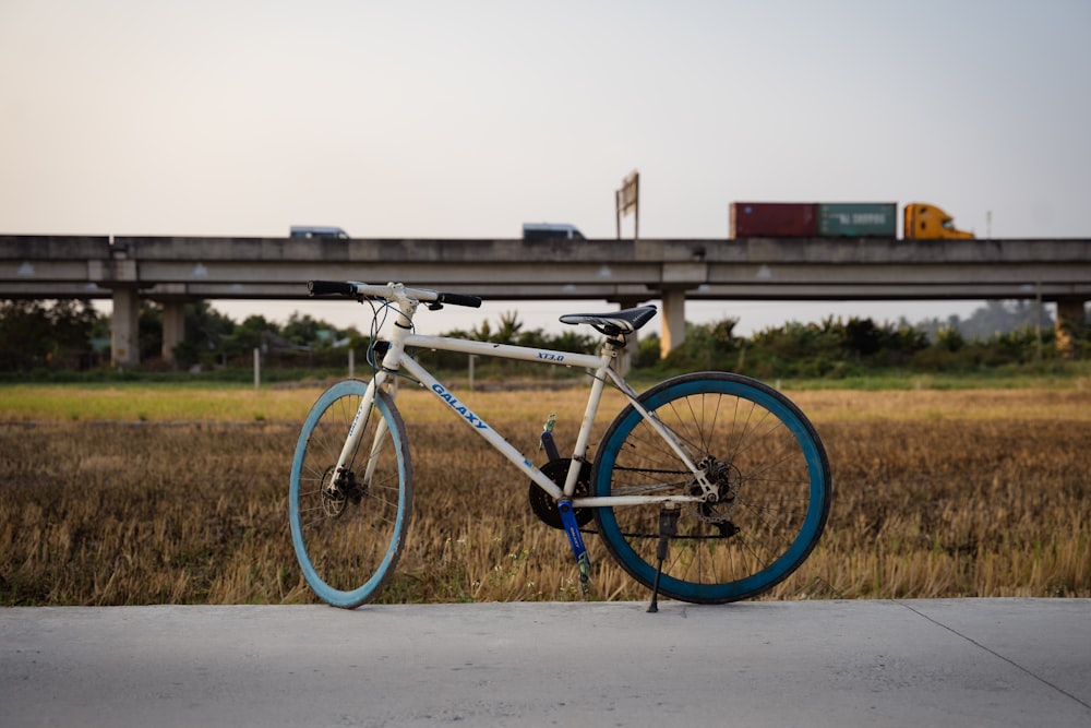 a bike parked on the side of a road