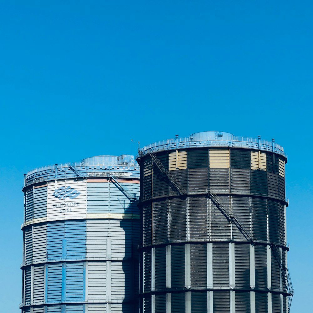 a large water tank sitting on the side of a road