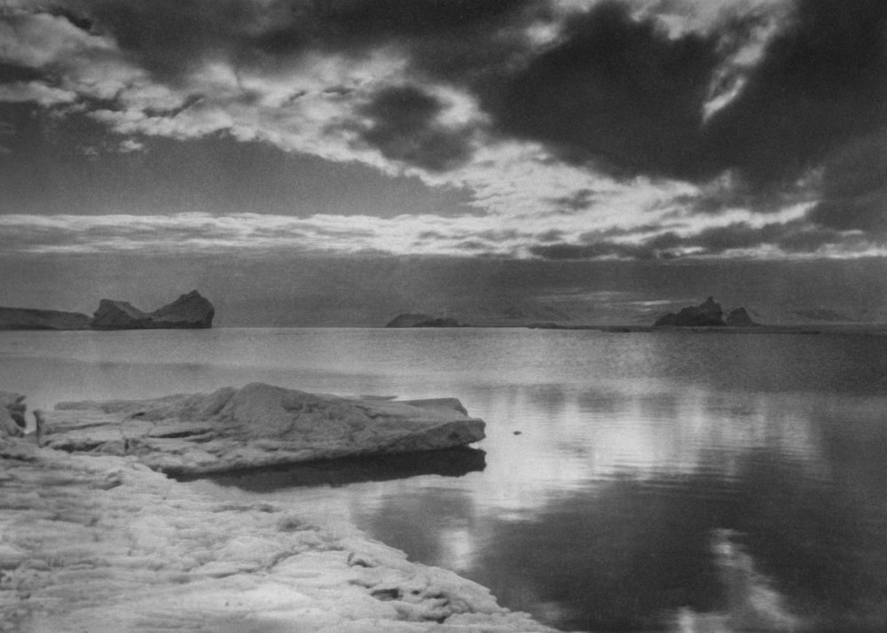 a black and white photo of a large body of water