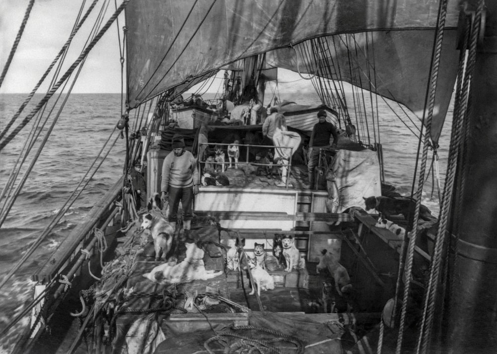 a black and white photo of a boat in the ocean