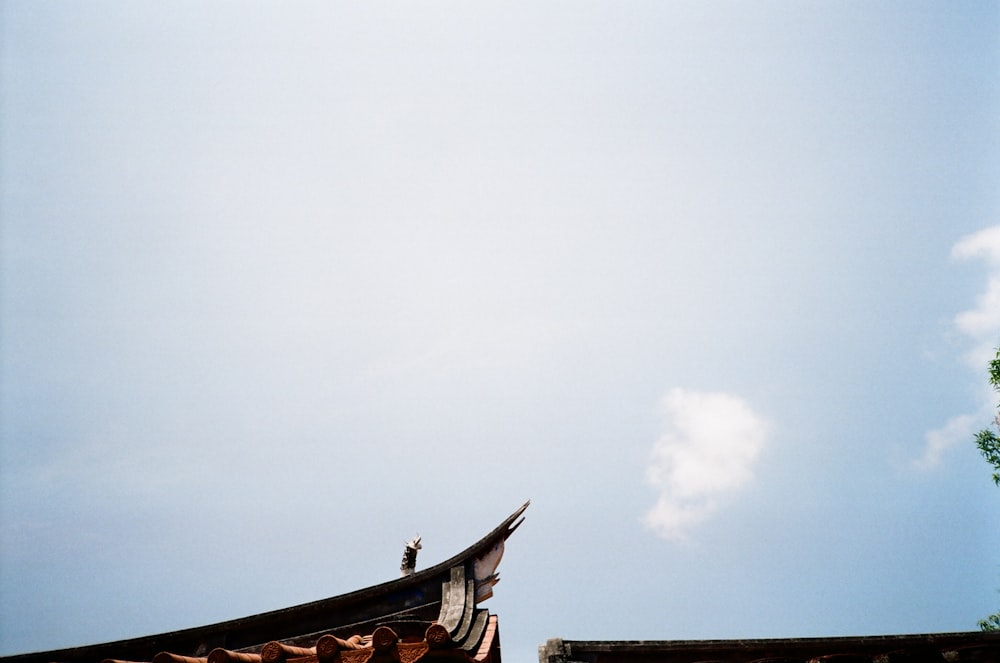 a view of a roof with a sky background