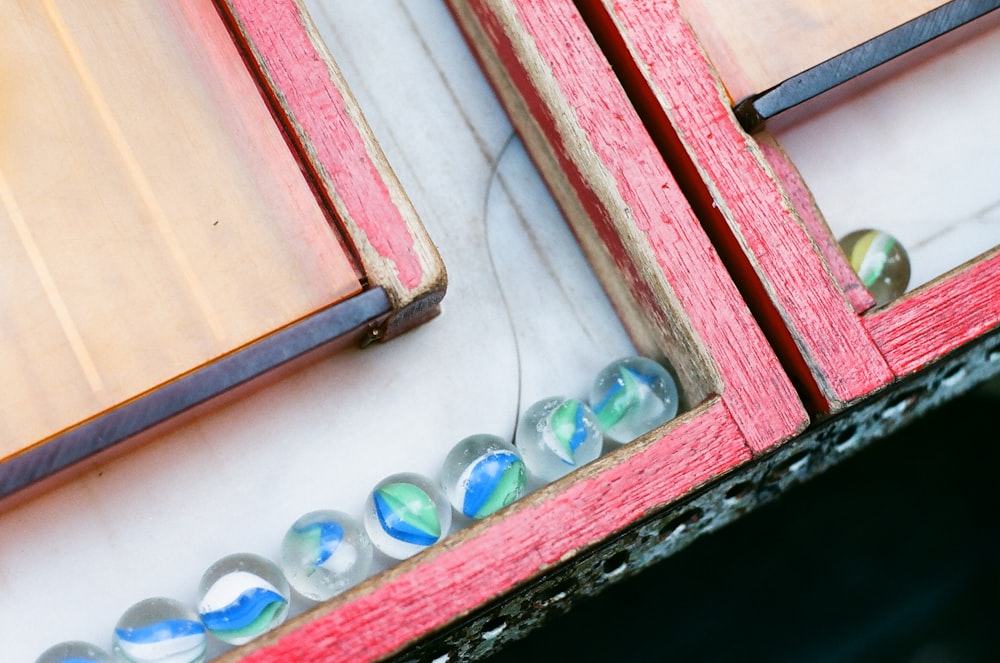 a close up of a mirror with a red frame