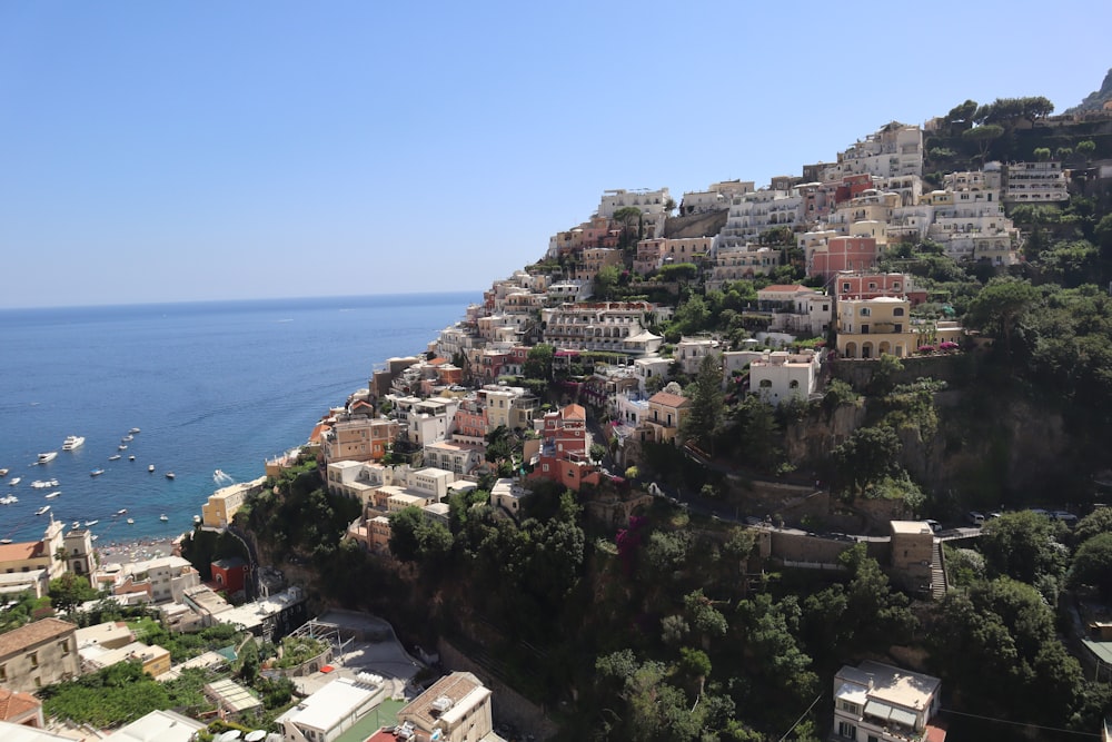 a view of a city on a cliff overlooking the ocean
