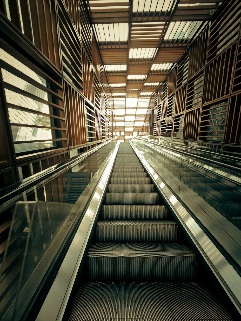 an escalator in a building with a bunch of stairs